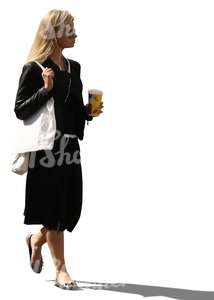 cut out backlit woman in a black dress walking