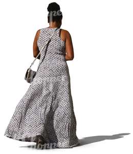 black woman in a long dress walking