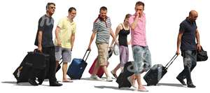 group of people with suitcases walking