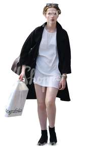 stylish woman in black and white with a shopping bag