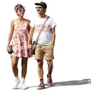 stylish couple walking hand in hand