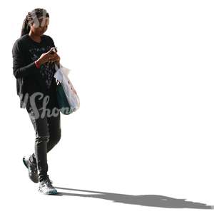cut out black woman walking and texting