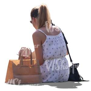 cut out backlit woman sitting and eating lunch