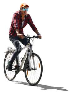 backlit young man riding a bike