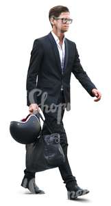 young businessman walking with a helmet and bag in his hand