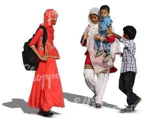 two hindu women with two boys walking