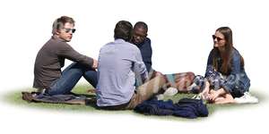 four people sitting on the grass