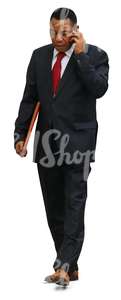 cut out black businessman walking while talking on the phone