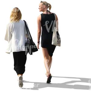 two women with blond hair walking and talking