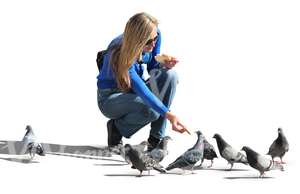 woman feeding pigeons