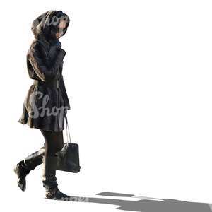 woman in a black hooded coat walking