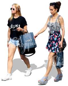 two women with shopping bags walking