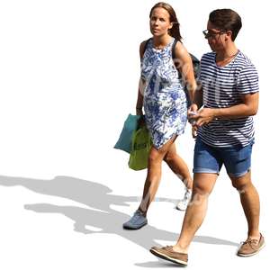 man and woman in summer clothes walking
