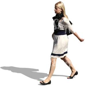 blond woman in a dress walking