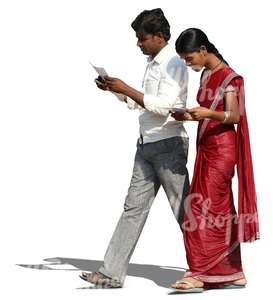 indian man and woman walking and reading something