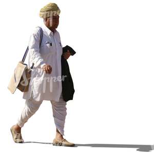 hindu man with a turban wearing ethnical indian attire walking