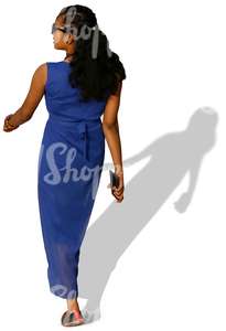 woman in a blue dress walking