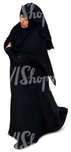 muslim woman in a black abaya walking