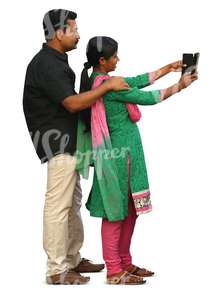 indian couple standing and taking a selfie