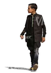 indian boy in a traditional jacket walking