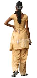 hindu woman in a yellow salwar kameez standing