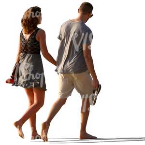 couple walking barefoot and holding hands