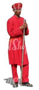 hindu man wearing a red suit and turban standing