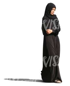 muslim woman in a black abaya walking