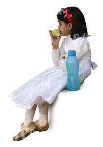 hindu girl in a festive white dress sitting