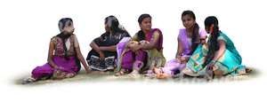 group of indian women sitting on the grass