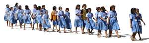 group of indian schoolgirls walking in a row