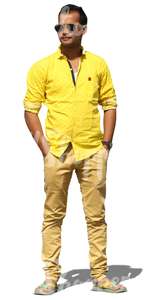 indian man in a yellow shirt standing