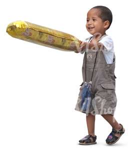 small latino boy with a toy walking