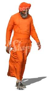 older hindu man in an orange costume walking