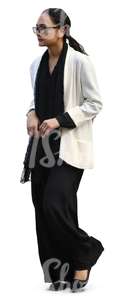 woman in a black and white outfit walking