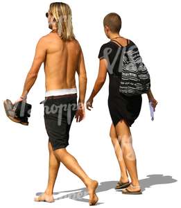 man and woman walking on the beach