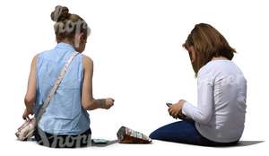 two teenage girls sitting
