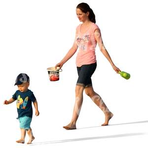 mother and son walking on the beach