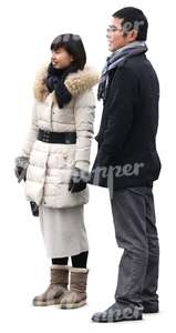 asian man and woman in winter clothes standing together