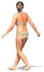 woman in a bikini walking on the beach