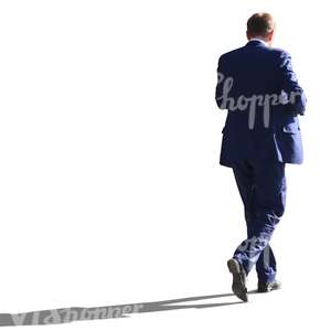 backlit businessman walking