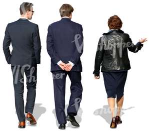 woman and two men in suits walking and talking