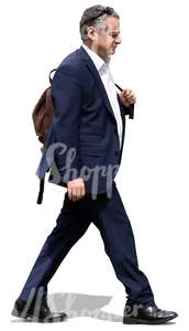 businessman with a leather backpack walking