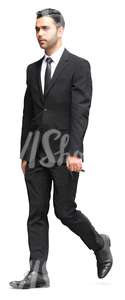 businessman in a black suit walking