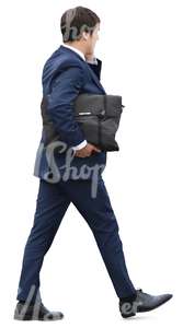 businessman with a briefcase walking and talking on the phone