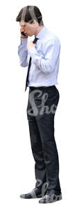 young businessman standing and talking on the phone