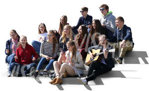 group of teenagers sitting on the stairs and singing