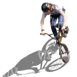 teenage boy riding a bmx in a skatepark