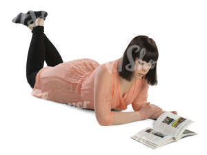 woman lying on the floor and reading a book