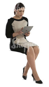 businesswoman sitting and working on her ipad